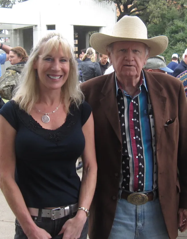 James posing with this author's wife, Julie, in Dallas.